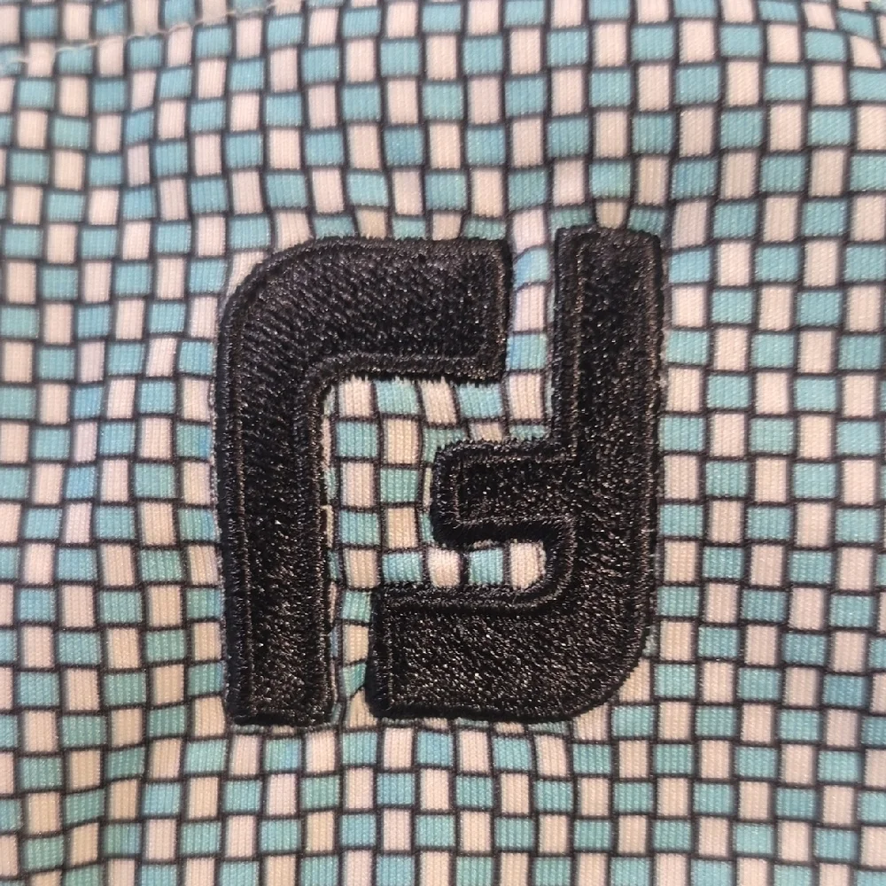 FootJoy Teal and Black Performance Polo Shirt - Picture 12 of 13